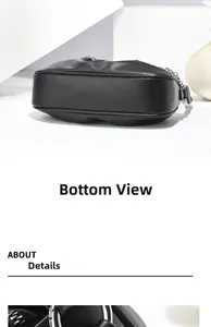 Detailed view of the wide oval base and silver chain strap on this black leather bag