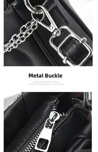 Detailed macro view of silver metal hardware and smooth zipper on black leather handbag