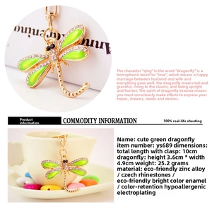 Detail view of green dragonfly keychain with zinc alloy, crystals and oil drip finish