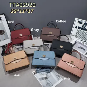 Detailed view of structured pleated handbags in seven colors with metal twist locks