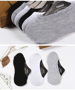 Detailed view of low-cut men's invisible boat socks in black, white, and grey colors