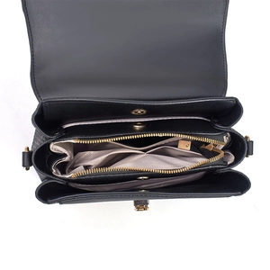 Detailed top view of the black leather bag interior with multiple compartments and gold zipper