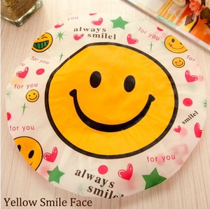Waterproof shower cap with yellow smiley face design for hair protection while bathing
