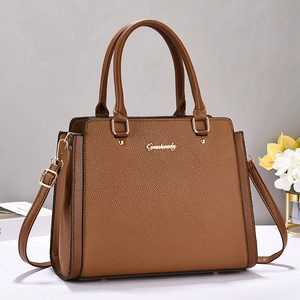 Brown litchi pattern vintage top-handle bag with golden hardware and long strap