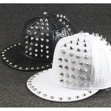 Detail of black and white crocodile texture baseball hats with silver metal studs and spikes