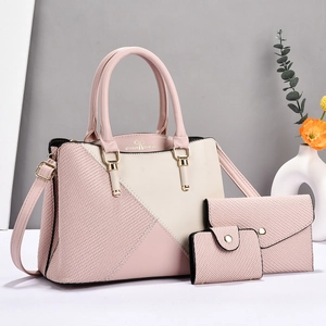 Three-piece pink and beige patchwork tote set with geometric woven texture and gold hardware