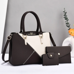 Three-piece tote set in brown and beige with woven texture and gold bow detail
