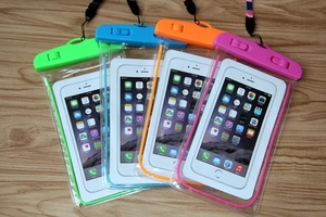 Detailed set of four colorful PVC waterproof phone pouches with secure locking seals