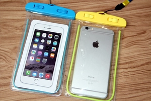 Close-up of sky blue and yellow waterproof phone cases with dual locking seal
