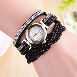 Close-up of a multi-layer wrap bracelet watch with sparkling rhinestones on model wrist