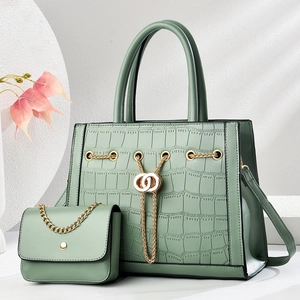 Light green crocodile pattern handbag set with golden chain detail and matching crossbody bag
