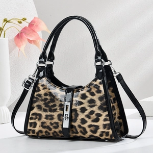 Chic leopard print crescent shoulder bag with glossy black trim and silver lock buckle