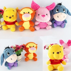 Close-up of Winnie the Pooh and friends plush toy characters with soft embroidery details