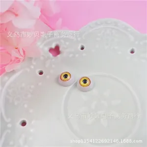 Detail of 12mm yellow resin doll eyes with radial texture for BJD DIY crafting