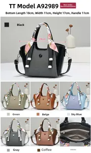 Detailed dimensions of the black paneled handbag with silk scarf handle decoration