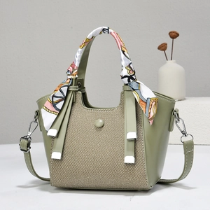 Avocado green fan-shaped handbag with woven splicing and silk scarf handle detail