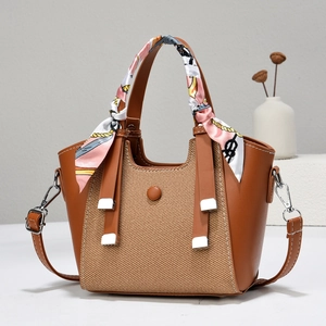 Brown leather and woven crossbody handbag with decorative silk scarf and long strap