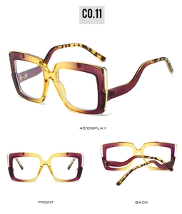 Macro detail of oversized square glasses frames with purple gradient and tortoiseshell temples