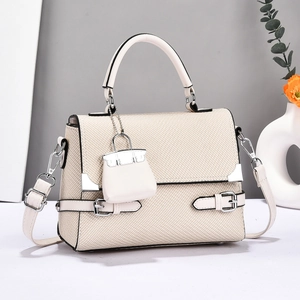 Chic beige canvas patchwork tote bag with top handle and adjustable shoulder strap