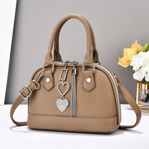 Fashionable brown lychee pattern shell bag with silver heart pendant and shoulder strap