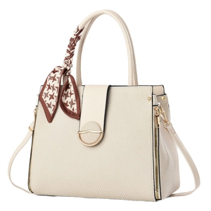 Elegant off-white textured leather handbag with a brown houndstooth silk scarf handle