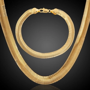 Detail of 18K gold-plated herringbone snake chain necklace and matching bracelet set