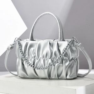 Silver metallic pleated cloud handbag with chunky chain strap and dual handles