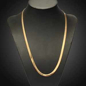 Minimalist 18K gold plated flat snake chain necklace displayed on a black neck bust