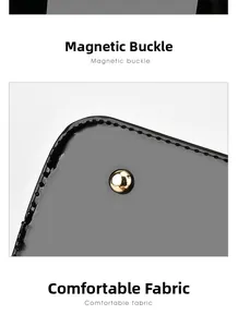 Detail of the golden metal snap button and fine stitching on a black leather handbag