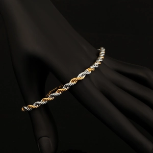 Classic 18K gold and silver plated twist rope chain bracelet on a black background