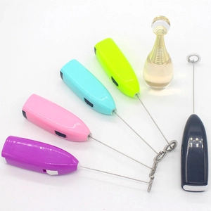 Top view of five colorful handheld electric milk frothers with stainless steel whisks
