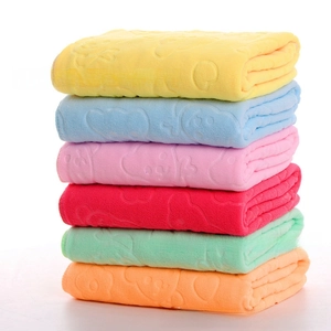 Detailed stack of embossed microfiber towels in six vibrant colors showing soft texture