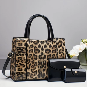Detailed close-up of leopard print 3-piece bag set featuring glossy patent leather textures