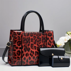 Three-piece leopard print handbag set with large tote, crossbody bag and small clutch