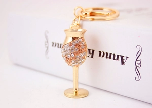 Detail of creative rhinestone wine glass keychain with sparkling gold plating finish