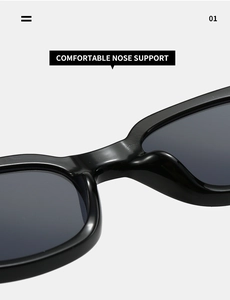 Macro view of the wide nose support on these black oval fashion sunglasses for men and women