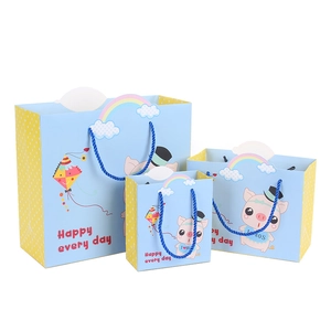 Cartoon pig gift bags in three sizes with blue nylon handles and polka dot details