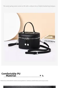 Detail of black PU leather bucket bag with silver zippers and fine textured finish