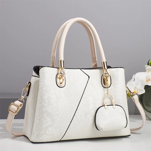 Fashionable faux snake-skin tote bag in off-white with gold hardware and mini pouch