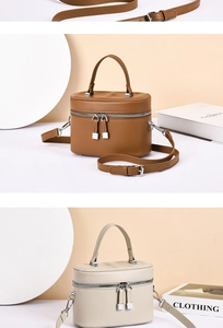 Close-up of retro cylinder crossbody bags in brown and beige smooth PU leather texture