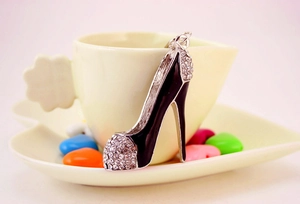 Detailed view of alloy high heel keychain with sparkling rhinestones and black enamel