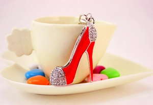 Detailed close-up of a red enamel high heel keychain decorated with sparkling crystals
