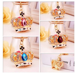 Detailed views of crystal crown keychains with assorted center gemstones and rhinestones