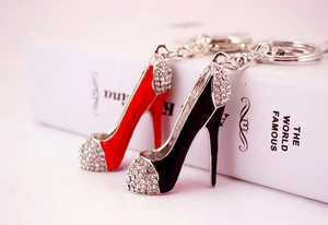 Detail of red and black high heel shoe keychains with sparkling crystal rhinestones