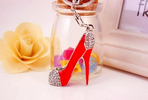 Macro shot of red high heel keychain with sparkling rhinestones and metal finish
