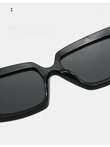 Macro detail of the integrated nose pads on black oversized square sunglasses for comfort