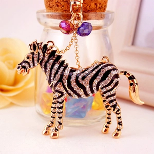 Sparkling crystal rhinestone zebra keychain in gold metal and black enamel finish
