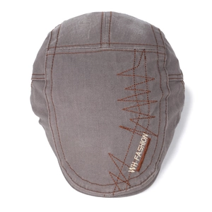 Retro grey cotton flat cap with brown stitching and decorative orange wavy embroidery