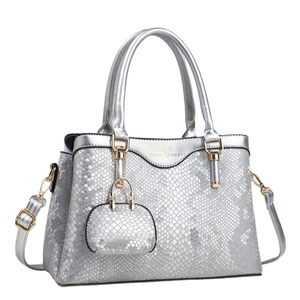 Silver snake pattern tote bag with top handles and detachable shoulder strap in 3/4 view