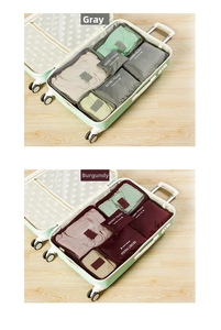 Detailed comparison of grey and burgundy waterproof travel organizer bags in a suitcase